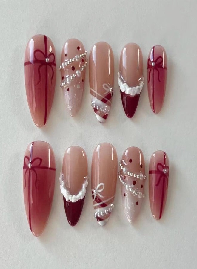 LRKNNO 30Pcs Christmas French Tip Press on Nails Medium Almond Fake Nails Nude Pink Glossy Glue on Nail with Pearl Rhinestone Red Bow Ribbon Designs Reusable Winter False Nail Xmas Acrylic Nails for Women - Image 1